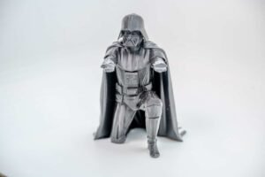 Darth Vader pen holder 3D printed in PLA holding a pencil