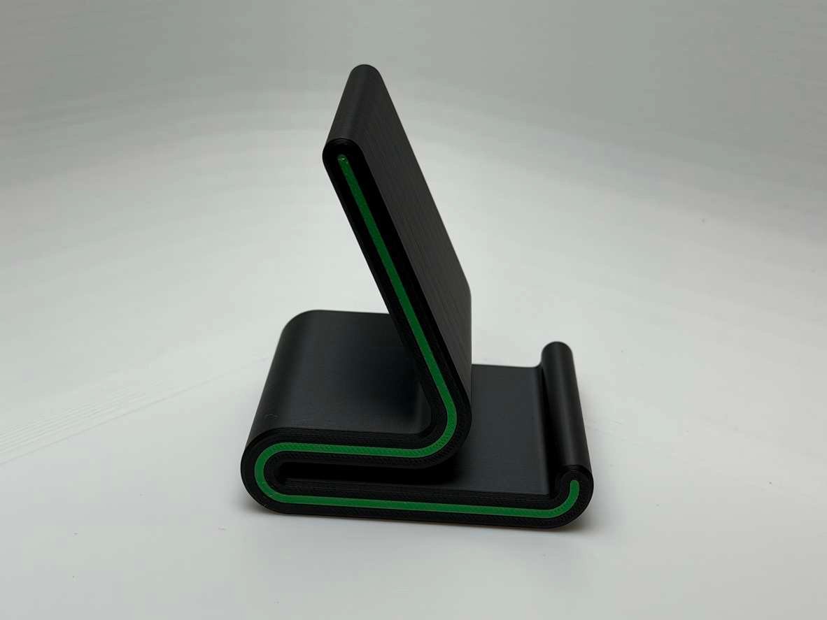 Green Streak 3D printed phone stand showing wrapped edge with green accent