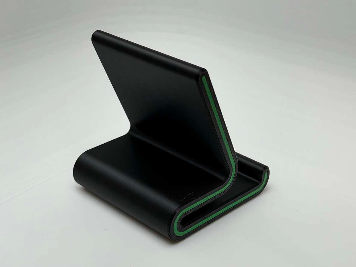 3D printed phone stand with phone placed on dock for scale