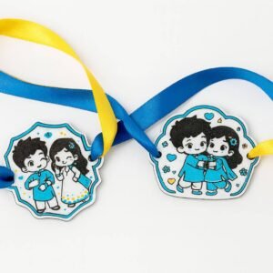 3D printed rakhi with cartoon sibling charm and yellow ribbon tie