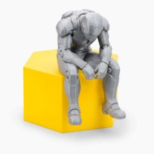 sad superhero desk figurine sitting on a ledge in grey PLA
