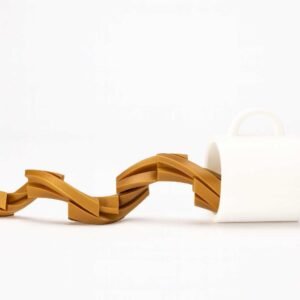 Coffee mug fidget toy showing a white mug with an articulated spilling coffee stream