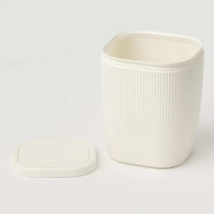 Mini desktop trash bin with lid beside bin, light/white PLA