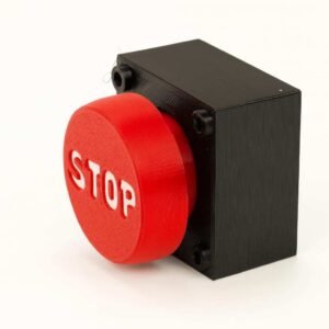 STOP button fidget clicker in red with black base, angled side view