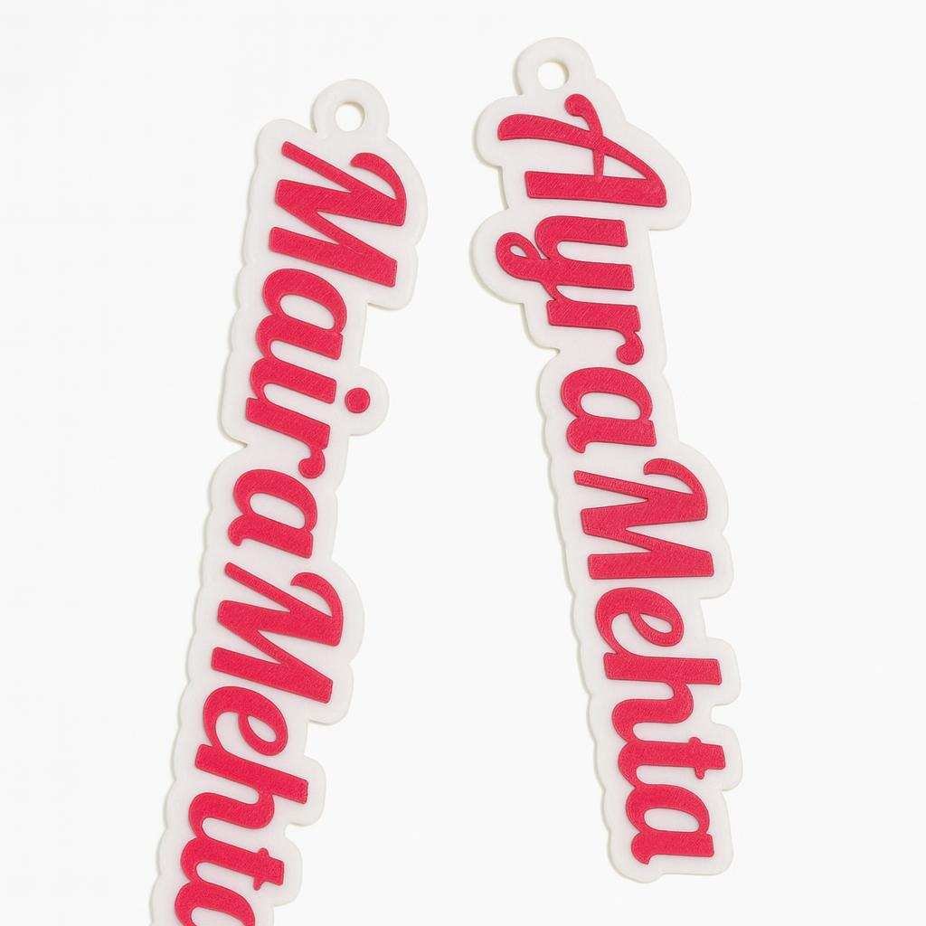 Custom 3D printed personalised name bag tag keychain shown in two names