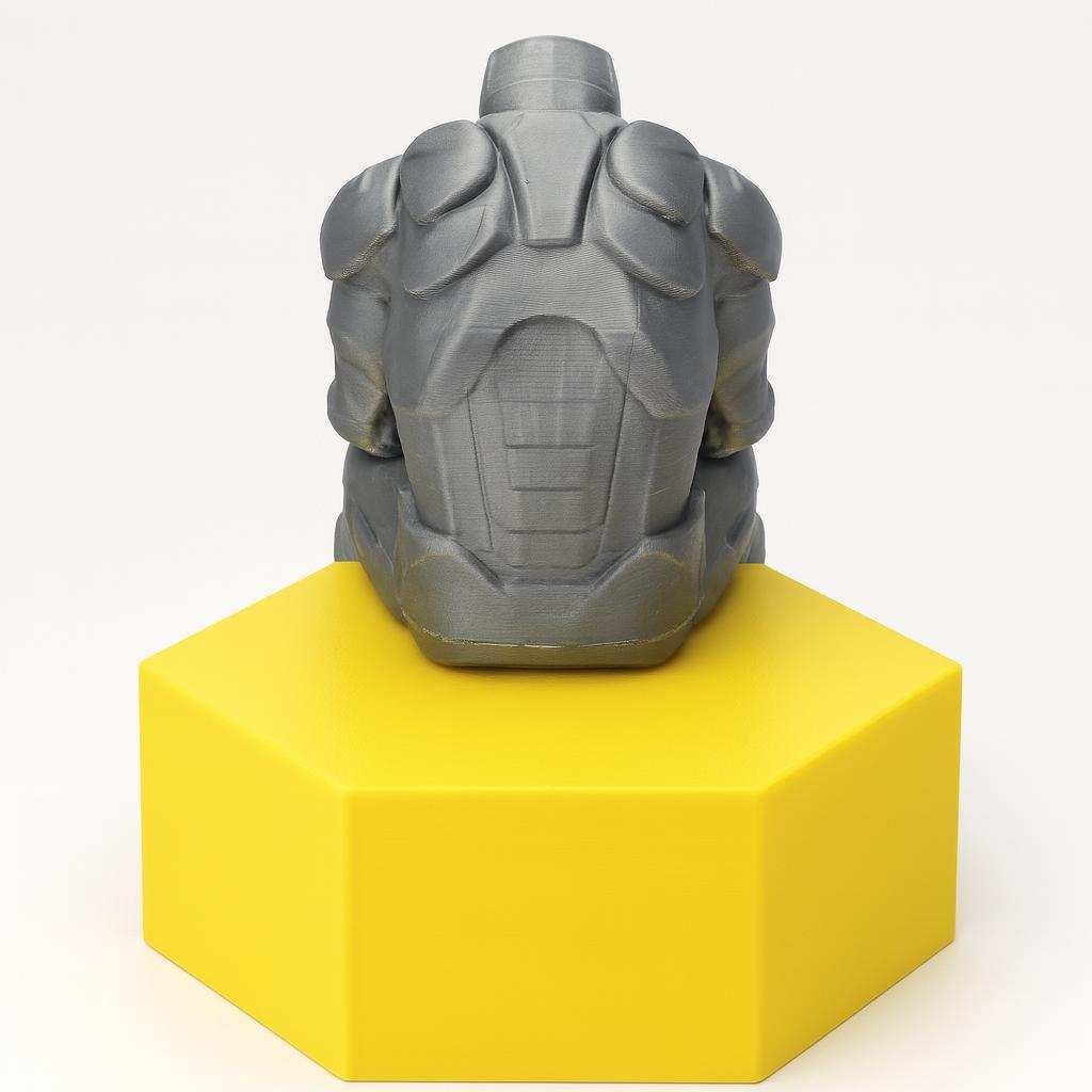 Side view of seated armored hero figure with legs hanging over edge