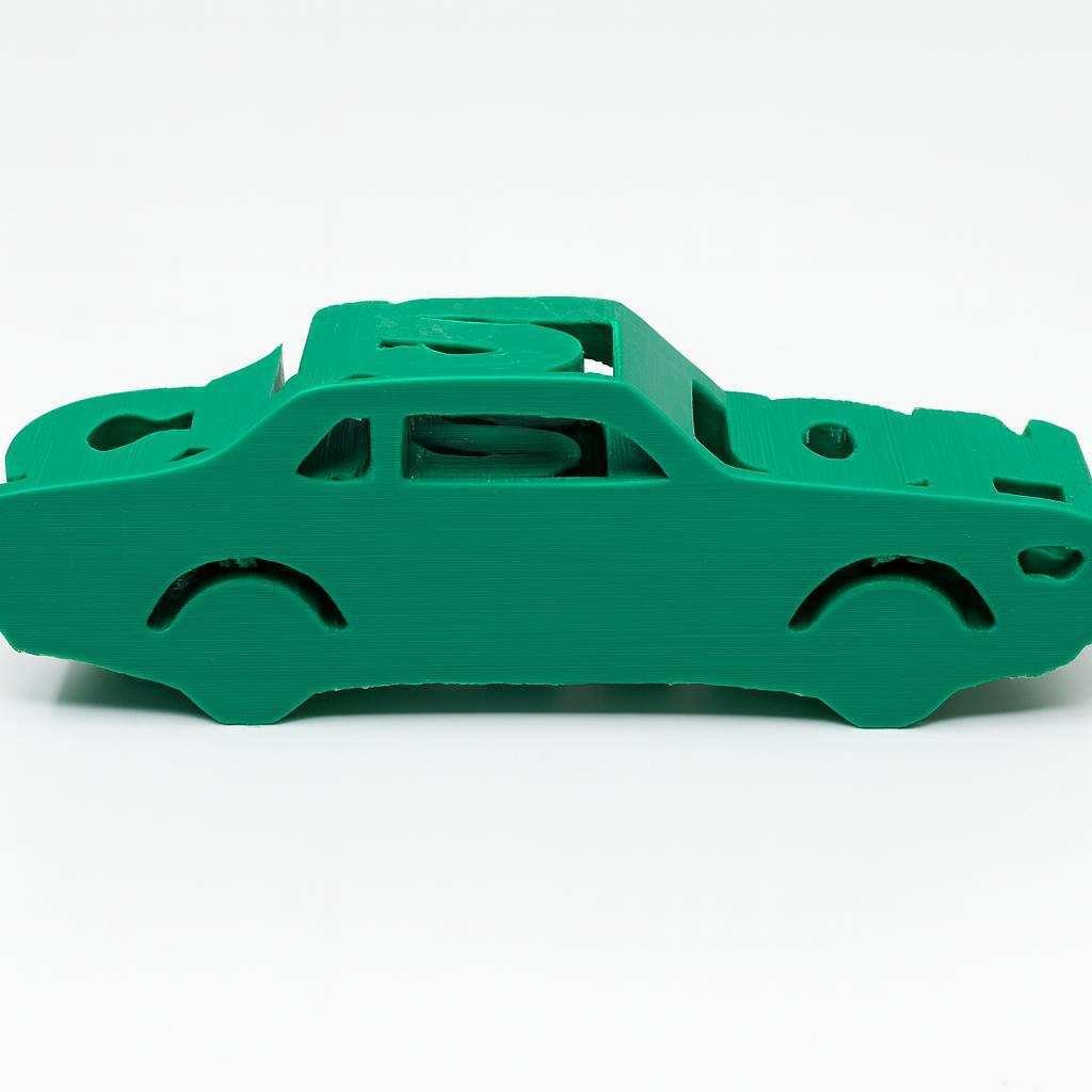 Side view of custom car name sign with integrated car silhouette