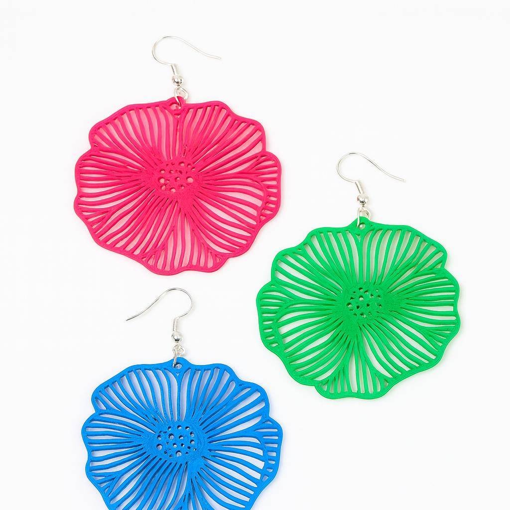 Blue openwork flower dangle earring close-up showing petal line detail