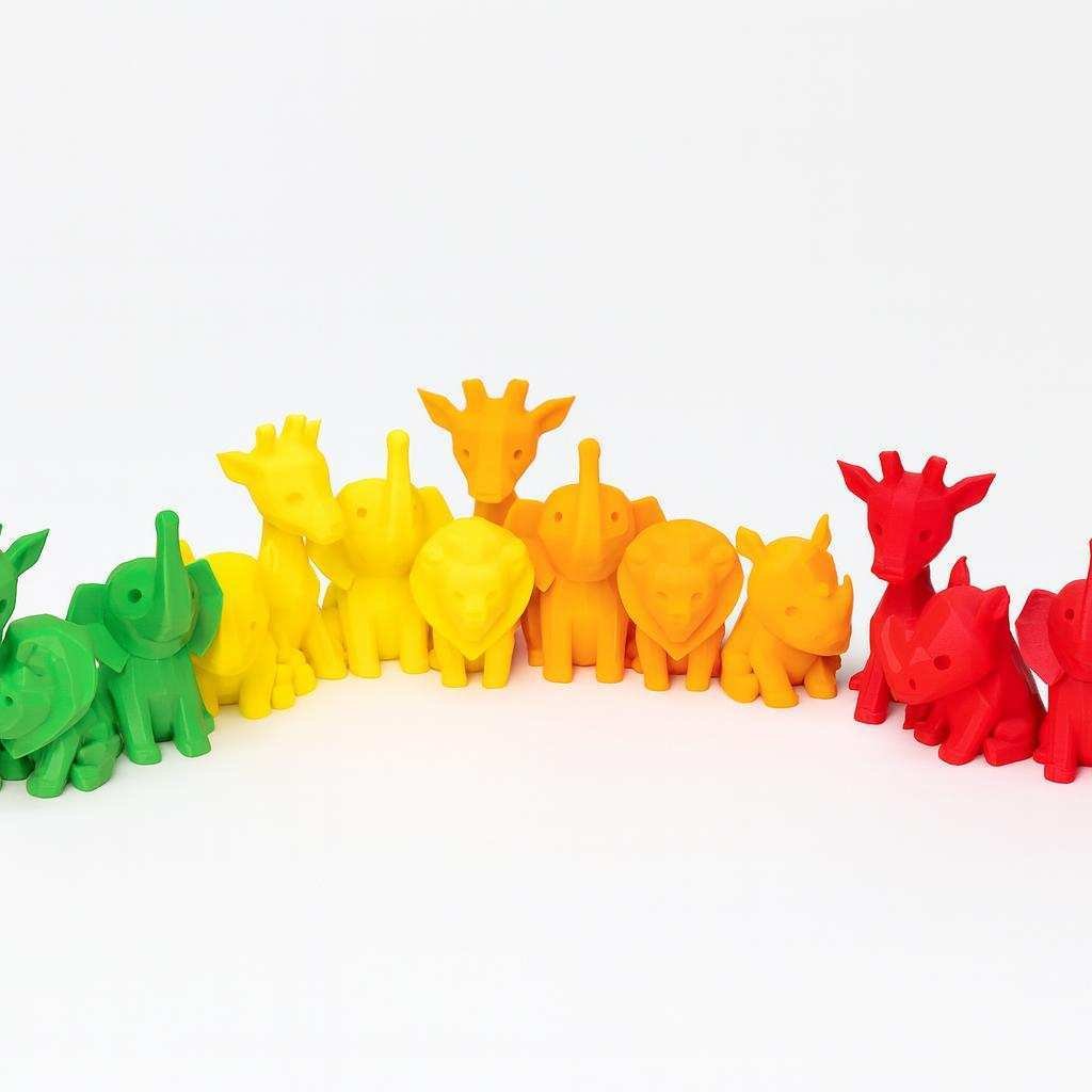 Colorful lineup of low poly safari animal figurines (green yellow orange red)
