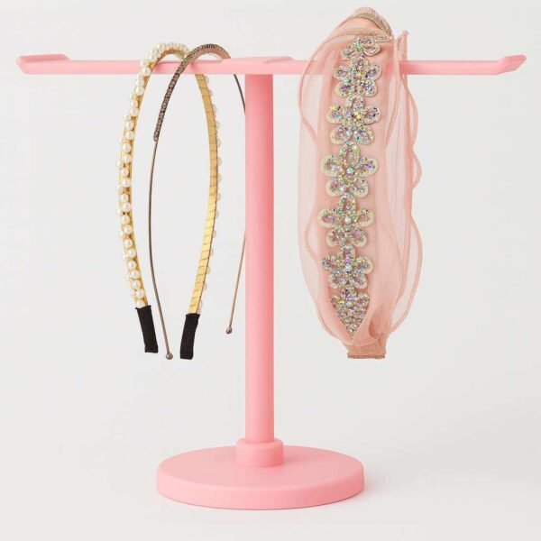 Headband holder stand holding several headbands for vanity organization
