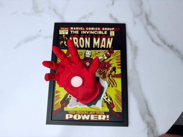 Iron Man comic wall art in a black frame with 3D pop-out red hand effect