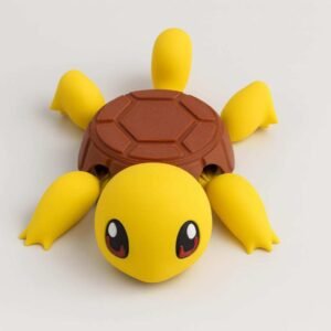 3D printed turtle coaster with yellow turtle body and brown shell