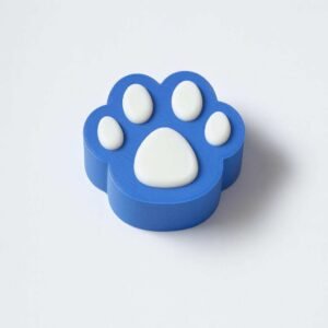 3D printed paw clicker in blue with white paw pads