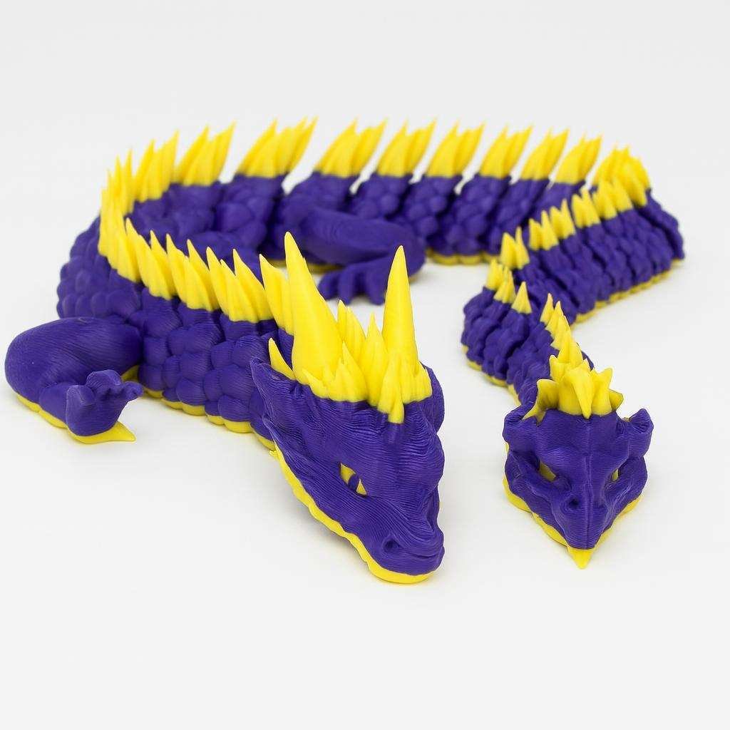 purple and yellow articulated dragon display model with segmented body